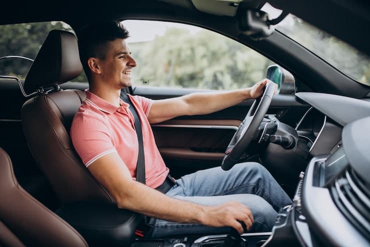 Licensed London private hire driver at the wheel